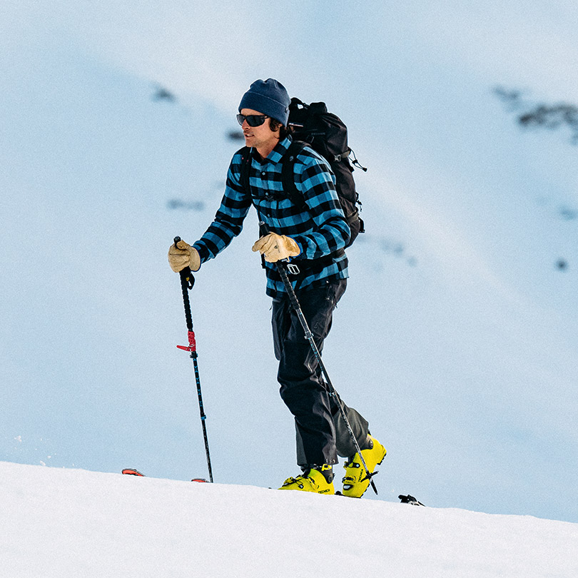 A man wearing a base layer for ski touring