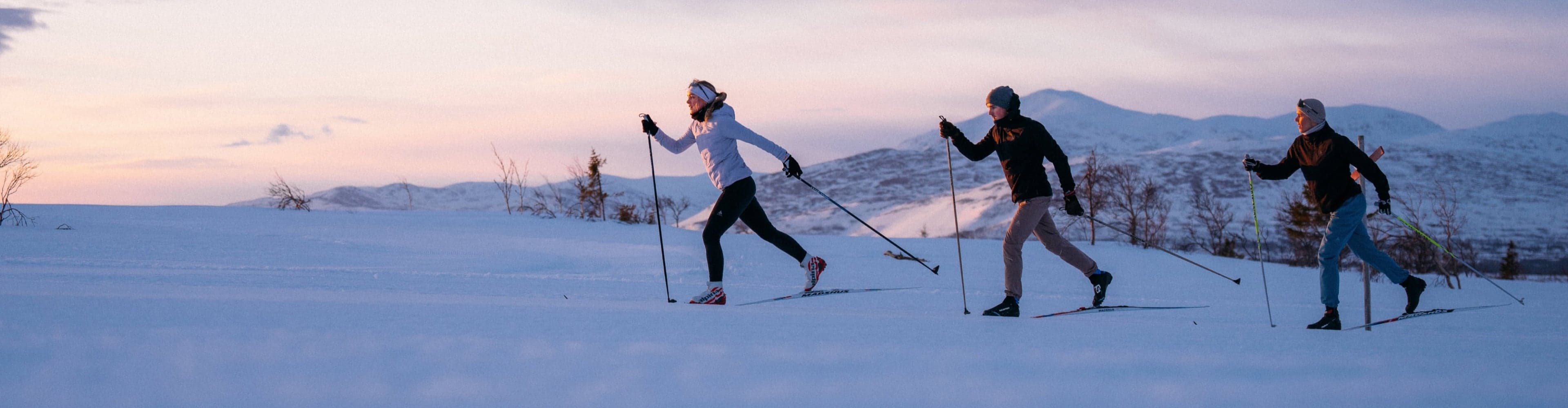 Women and men wearing cross country outfits