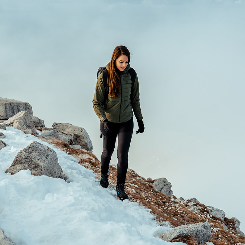 A woman wearing hiking gear